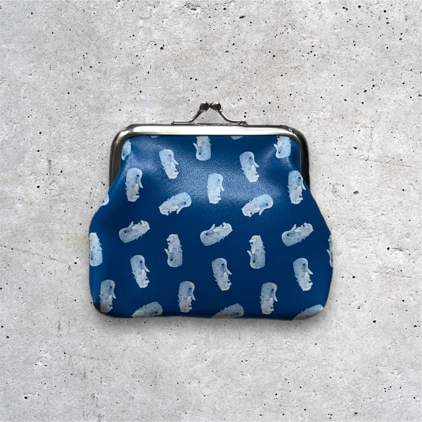 Merlion Kisslock Purse Navy. Merlion motifs arranged in a pattern.