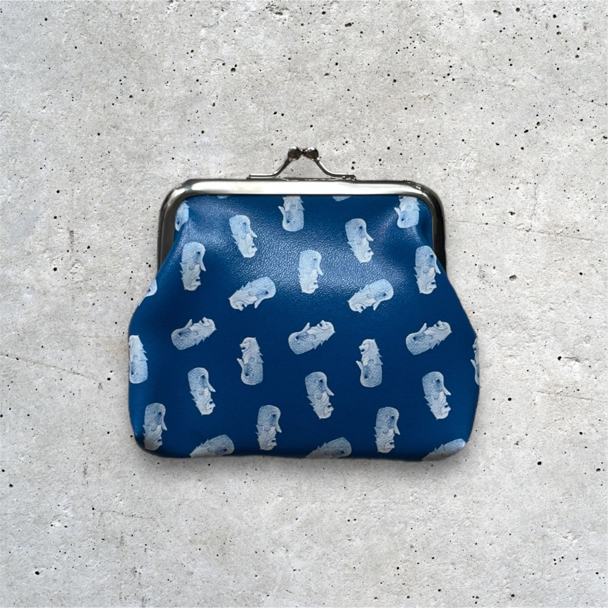 Merlion Kisslock Purse Navy. Merlion motifs arranged in a pattern.