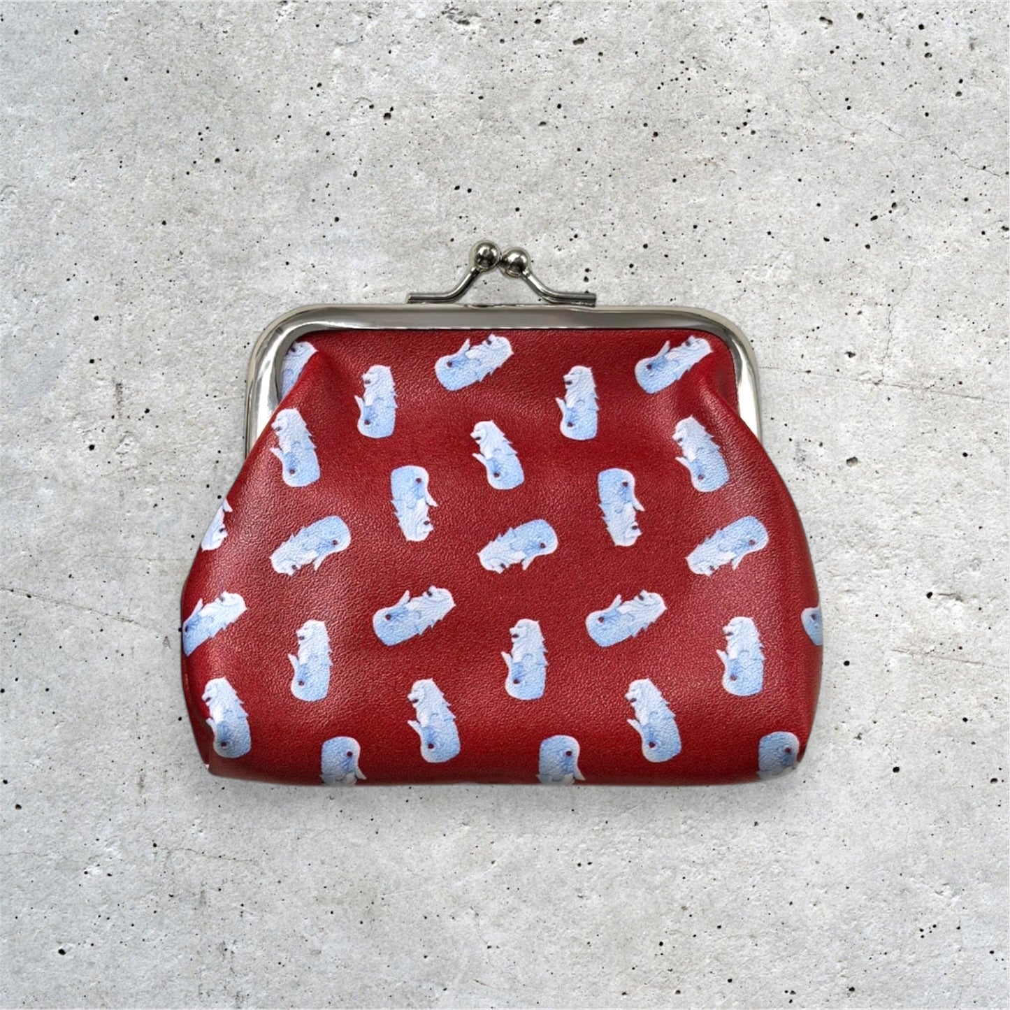 Merlion Kisslock Purse Red. Merlion motifs arranged in a pattern.