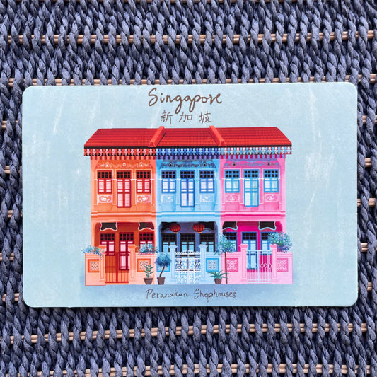 A colorful postcard featuring hand-drawn Peranakan shophouses in Singapore