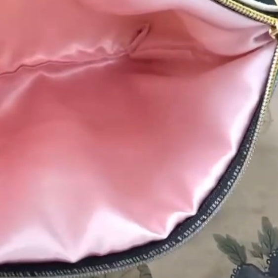 Shophouses Pouch Interior with pink satin lining