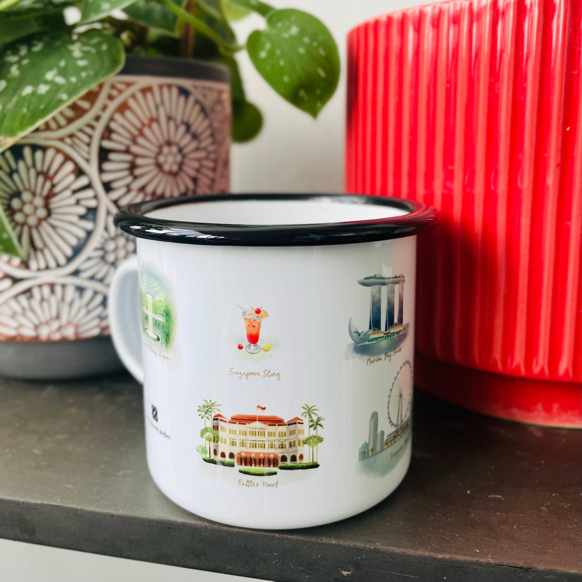 Singapore Icons Enamel Mug featuring various Singapore icons