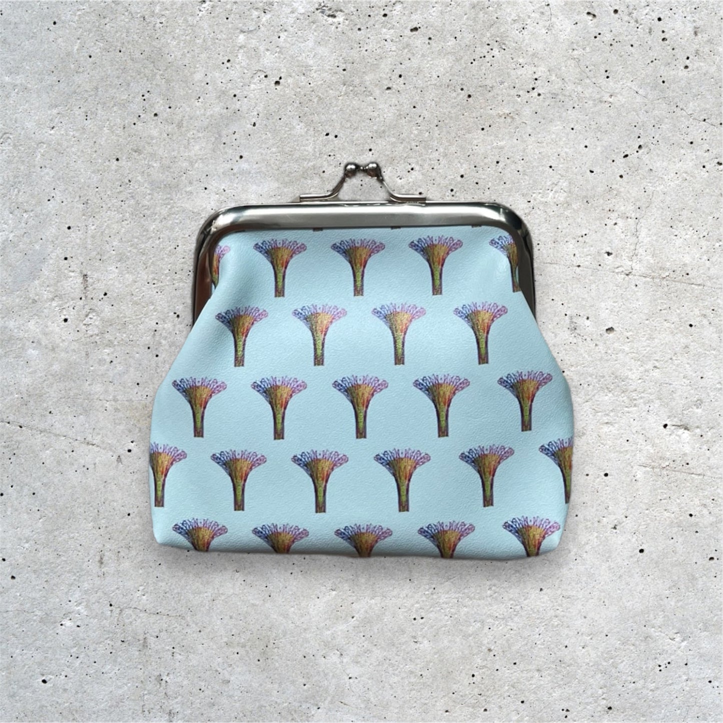 Supertrees Kisslock Purse Blue. Supertree motifs arranged in a pattern.