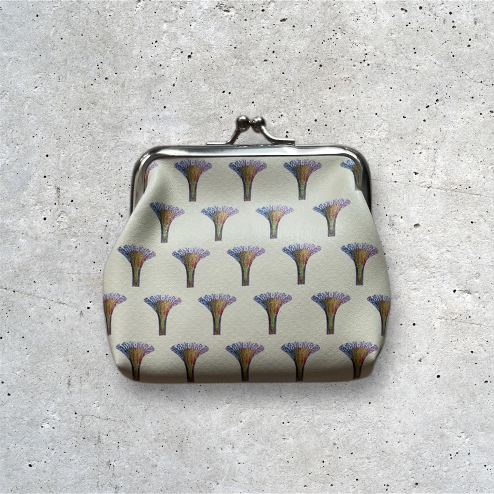 Supertrees Kisslock Purse Yellow. Supertree motifs arranged in a pattern.